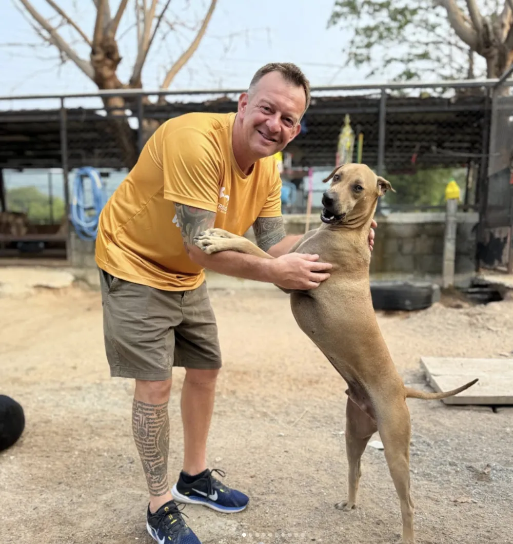 Kevin Marr volunteering at the TMTRD dog shelter in Thailand