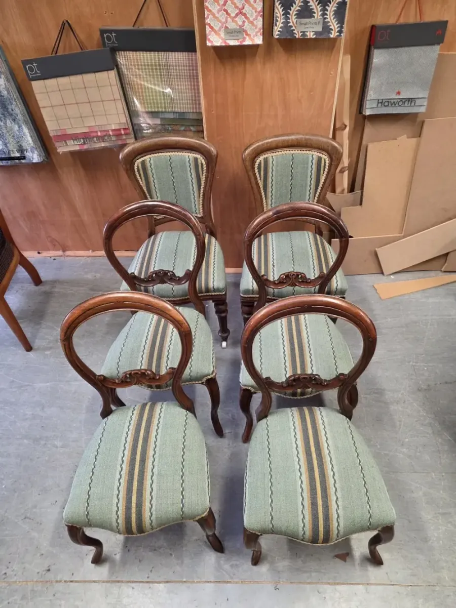 A set of antique dining chairs reupholstered