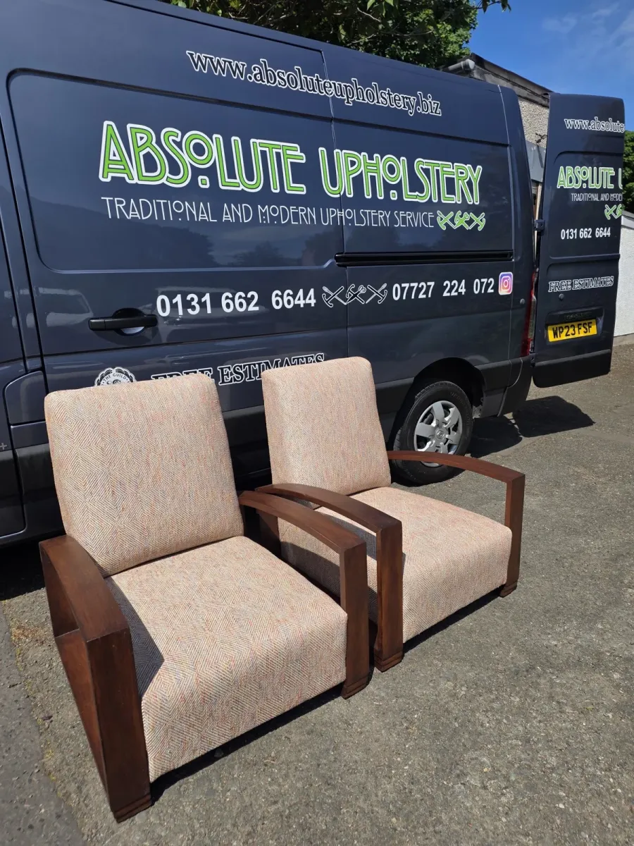 A pair of wood-framed art deco armchairs reupholstered