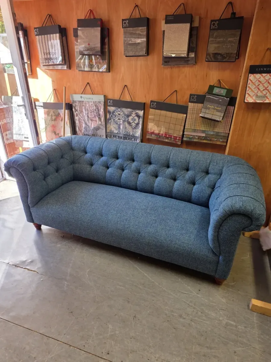 Deep-buttoned chesterfield sofa reupholstered in blue wool tweed