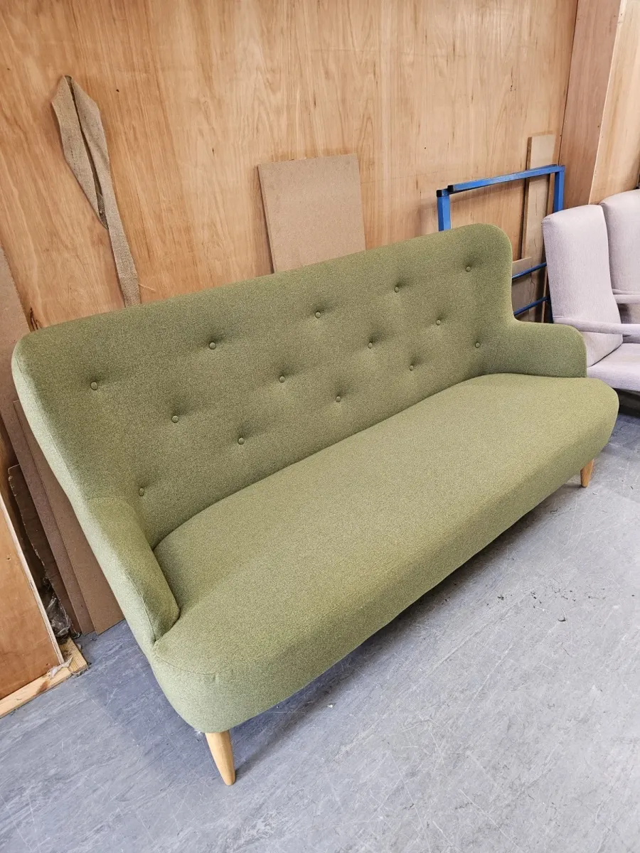 Mid-century sofa reupholstered and buttoned in green wool