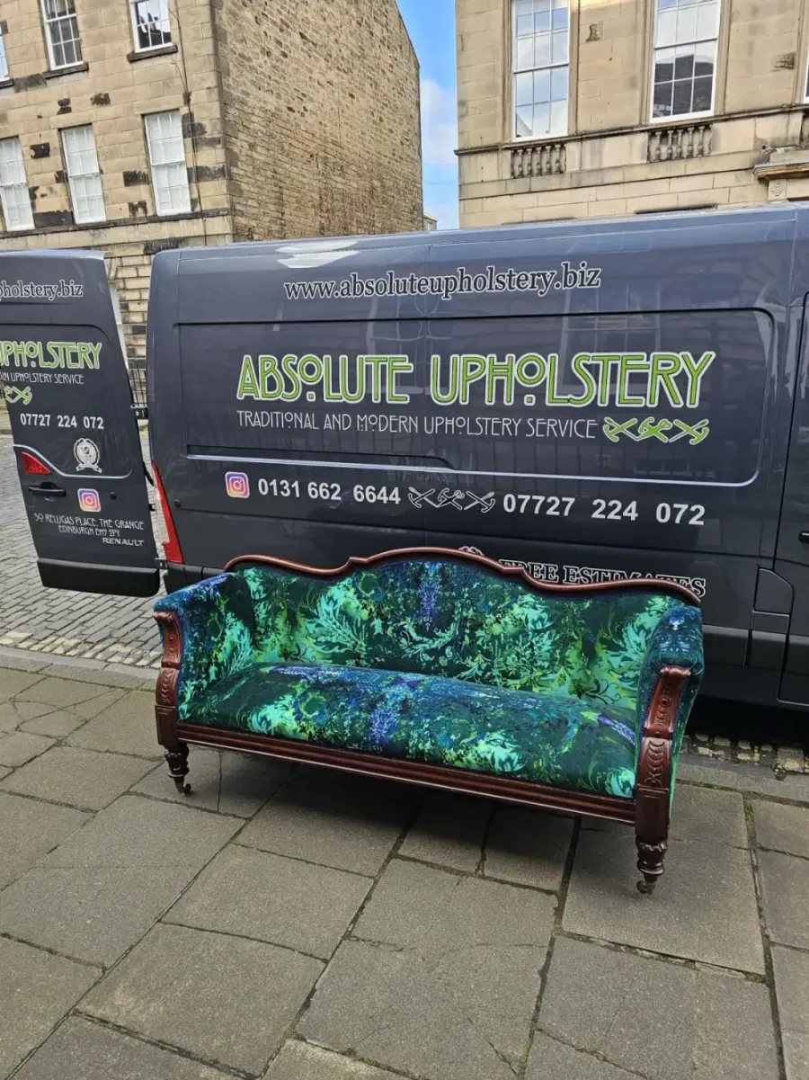 Antique sofa reupholstered in a green patterned weave