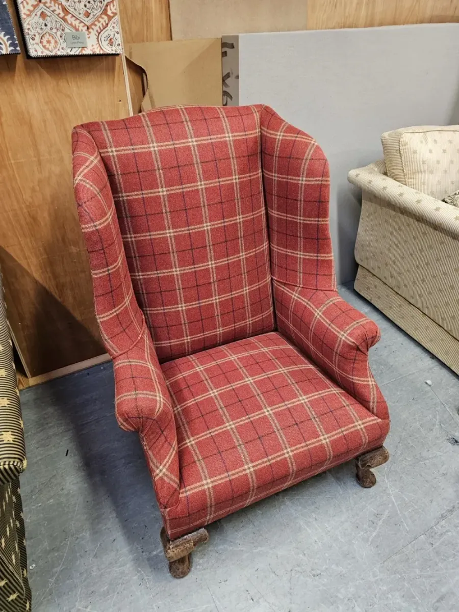 High-back armchair reupholstered in plaid wool
