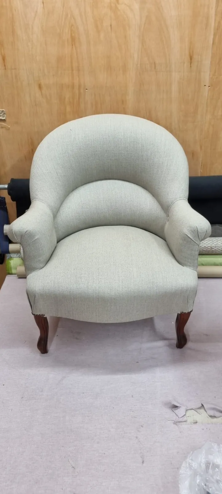 Antique tub chair reupholstered in a sage-green linen