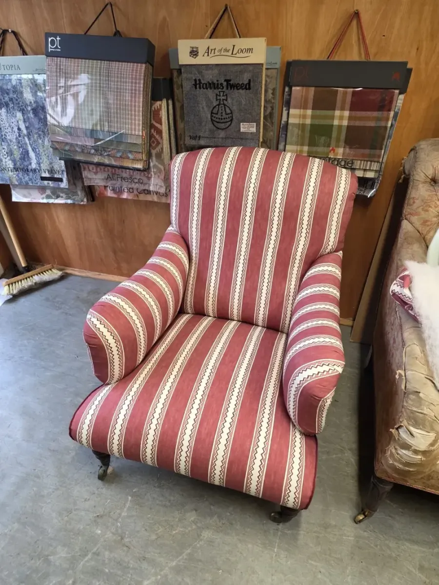 Armchair reupholstered in a striped fabric