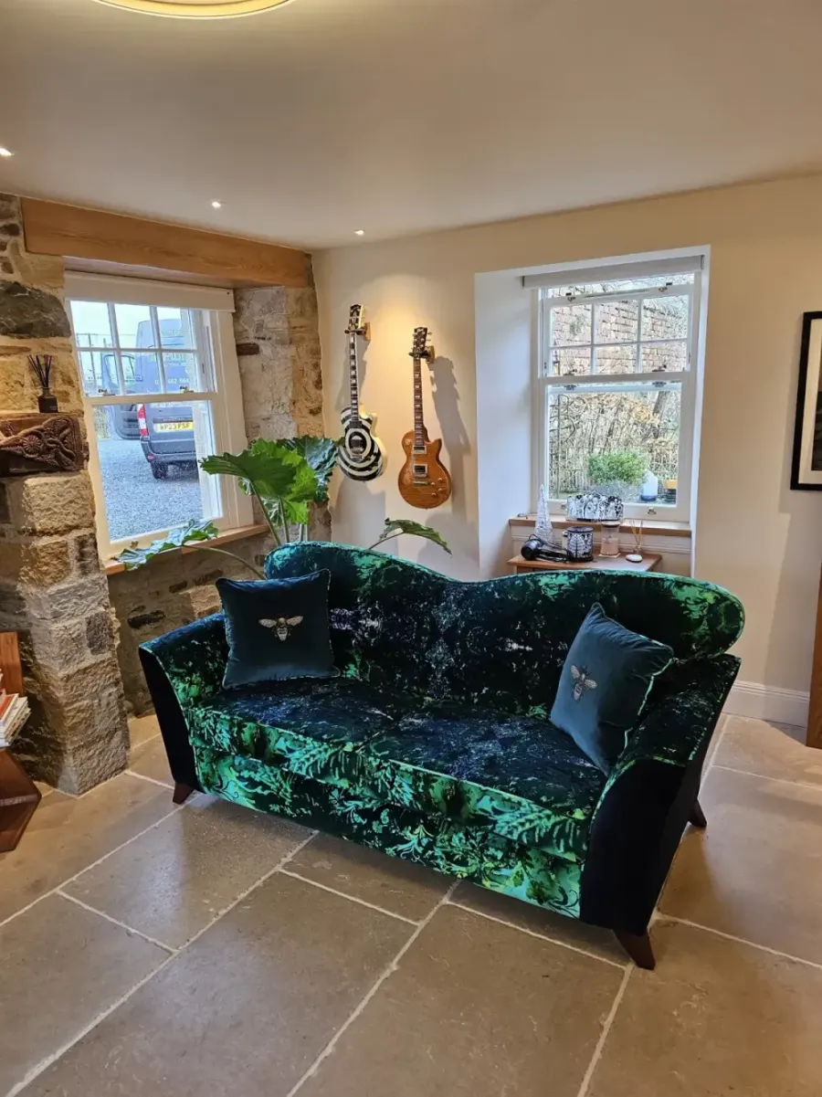Sofa reupholstered in a bold Timorous Beasties fabric