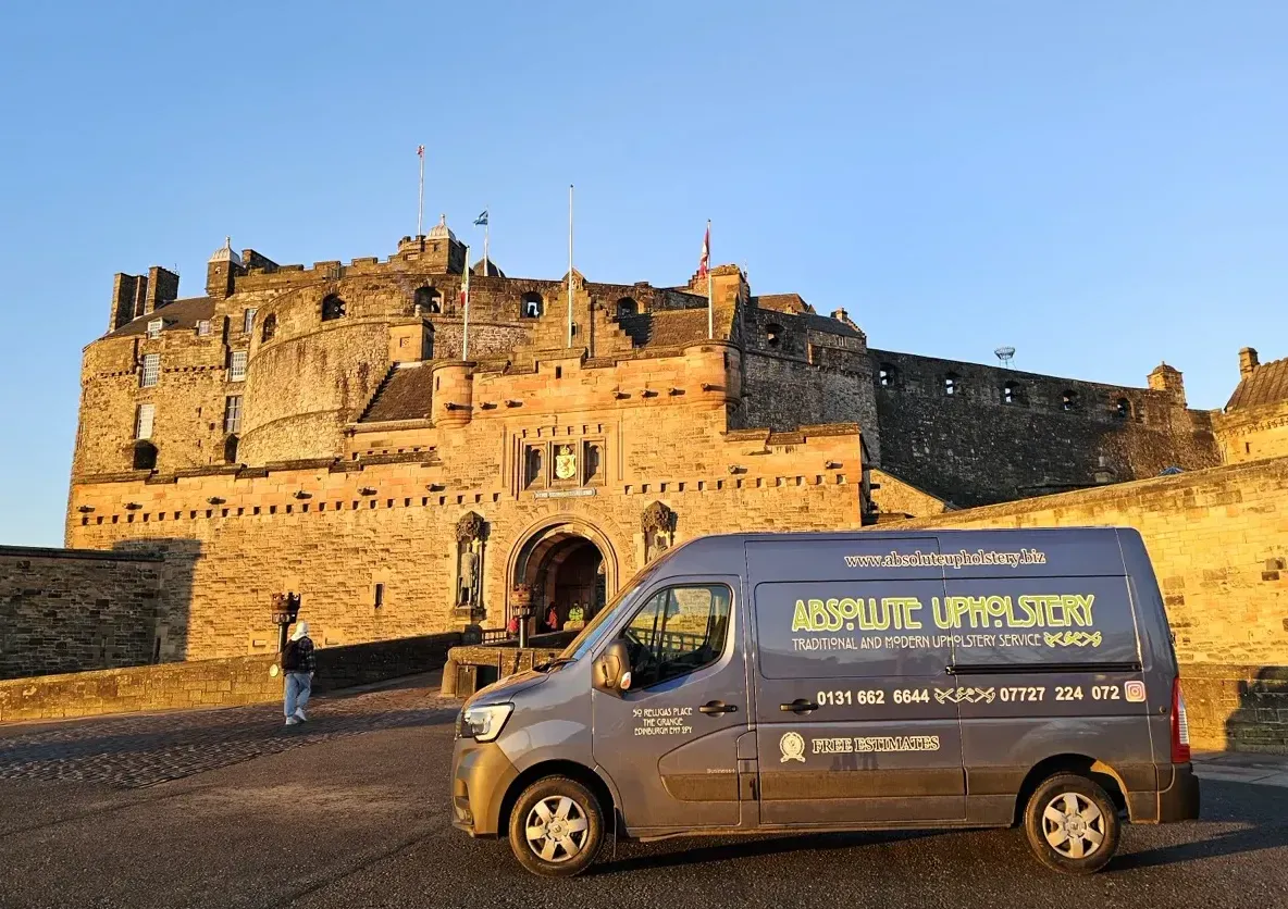 The Absolute Upholstery van parked in front of Edinburgh Castle