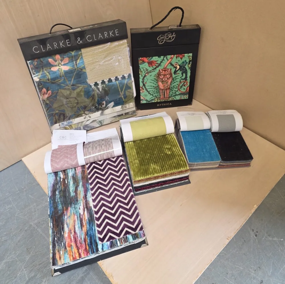 Fabric sample books and velvet swatches from Clarke & Clarke and other houses